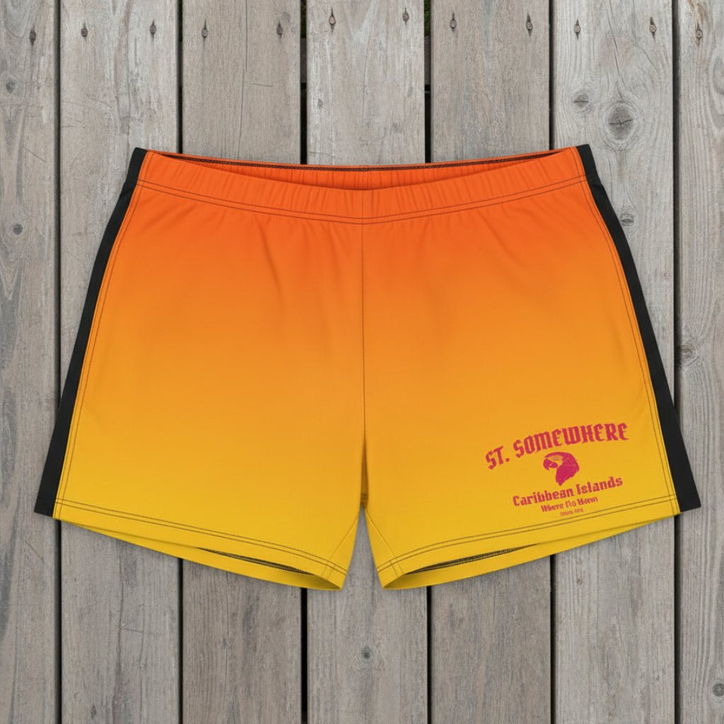 Orange and yellow swim shorts with 'St. Somewhere' branding on a beach.