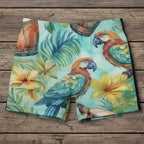 Tropical-themed swim shorts with parrots and flowers on a rustic wood background