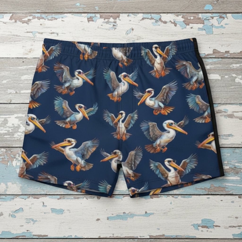 Navy swim shorts with pelican pattern on nautical wood background
