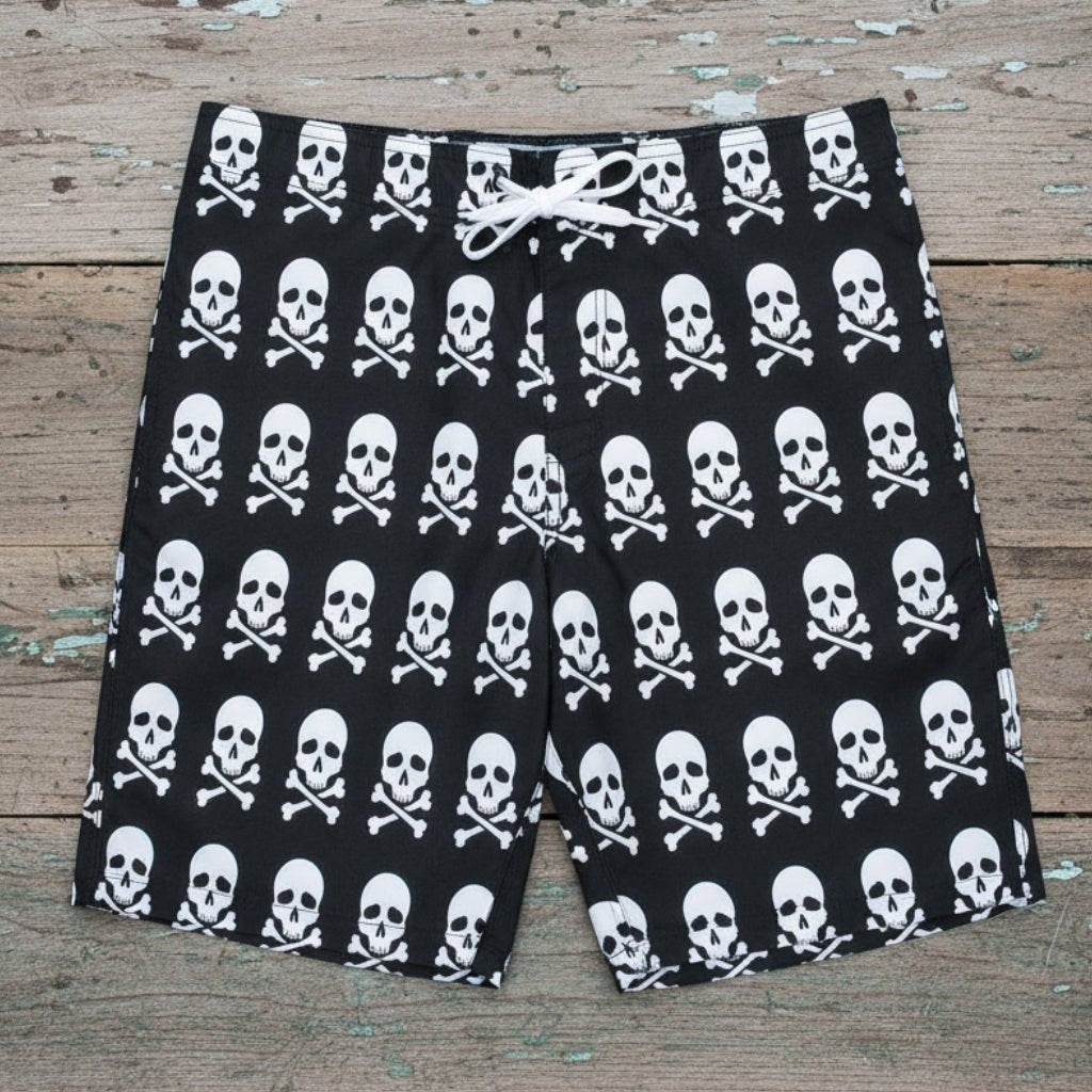 black shorts with white skull and crossbones pattern on a rustic wood background