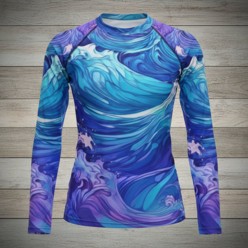 Blue and purple wave-patterned shirt on a wooden surface with coconuts and a cap.