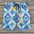 Tie-dye patterned shorts with a drawstring on a rustic nautical wood deck