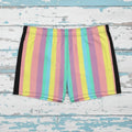 Multicolored striped swim shorts on rustic nautical wood background