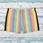 Multicolored striped swim shorts on rustic nautical wood background