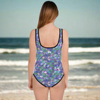 Woman wearing a mermaid scale swimsuit on a beach