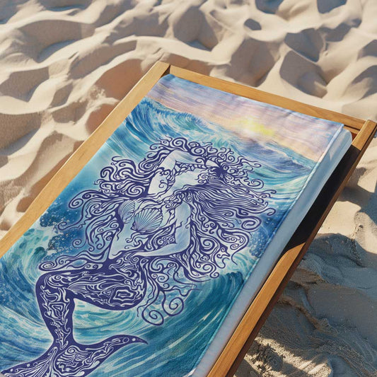 Zen Mermaid printed on a plush beach towel laying on a wooden beach chair in the sand