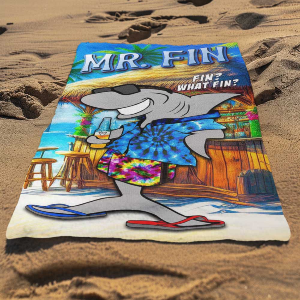 Mr. Fin Beach Towel laying in the sand