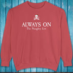 Red sweatshirt with text 'ALWAYS ON The Naughty List' on a blue wooden background