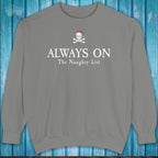 Gray sweatshirt with a skull and crossbones design and text on a blue wooden background