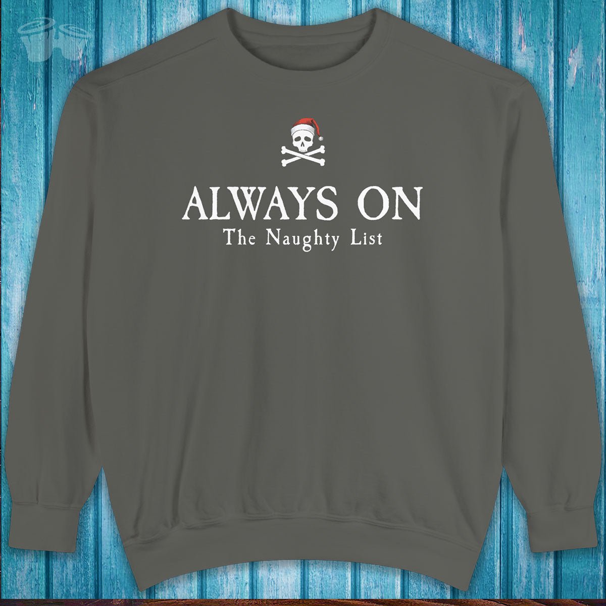 Gray sweatshirt with text 'ALWAYS ON The Naughty List' on a blue wooden background
