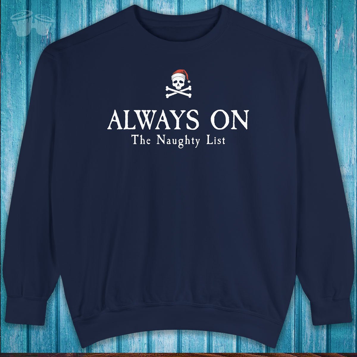 Navy blue sweatshirt with a skull and crossbones design and text on a wooden background