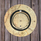 Vintage Nautical Chart Bucket Hat laying upside down on a rustic wood pier.