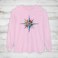 Pink long-sleeve shirt with a colorful star design on a wooden surface