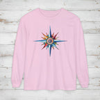 Pink long-sleeve shirt with a colorful star design on a wooden surface