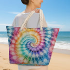 Person holding a tie-dye bag with a spiral pattern in an outdoor setting
