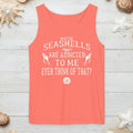 Coral tank top with white text on nautical wood with sand and seashells