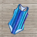 blue and purple striped swimsuit on a rustic nautical wood deck
