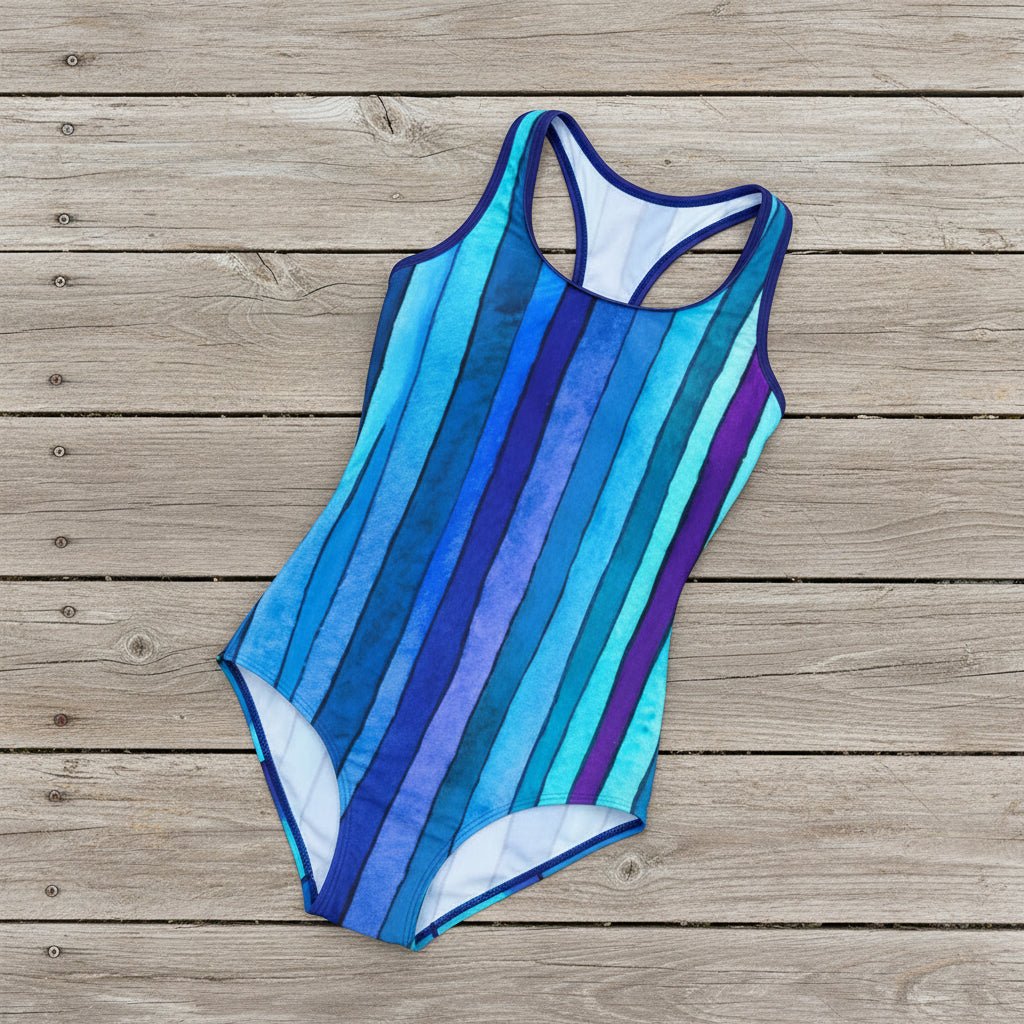 blue and purple striped swimsuit on a rustic nautical wood deck