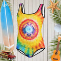Teen Tie Dye Swimwear with cool sea turtle silhouette on classic tie dye floating in front of a rustic wood wall surrounded by surfing icons and beach favorites.