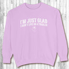 Purple sweatshirt with text on a wooden background