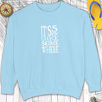 Light blue sweatshirt with 'It's 5 o'clock somewhere' text on a wooden surface.