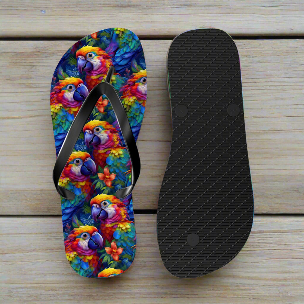 Flip-flop with colorful parrot design and black insole on a nautical wood background