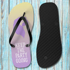 Flip-flop with purple insole and black sole on a wooden surface