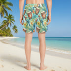 Guy wearing ParrotHead Tropical-themed shorts with parrots and drums looking out at the ocean from a Caribbean Island Beach.