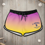 Colorful gradient shorts with a St. Somewhere logo on a rustic nautical wood background