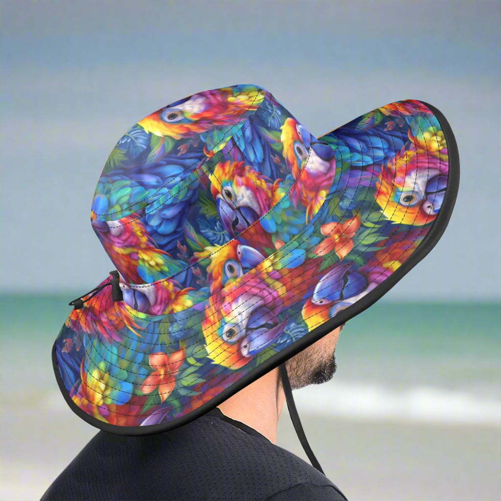 Colorful parrot head-patterned sun hat on a dude standing on a gulf shore beach