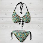 Bikini set with parrot and floral pattern on a white background