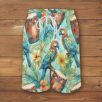 Tropical-themed shorts with parrots, drums, and flowers on a nautical wood background