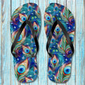 Colorful peacock feather pattern flip-flops against a wooden background