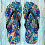 Colorful peacock feather pattern flip-flops against a wooden background