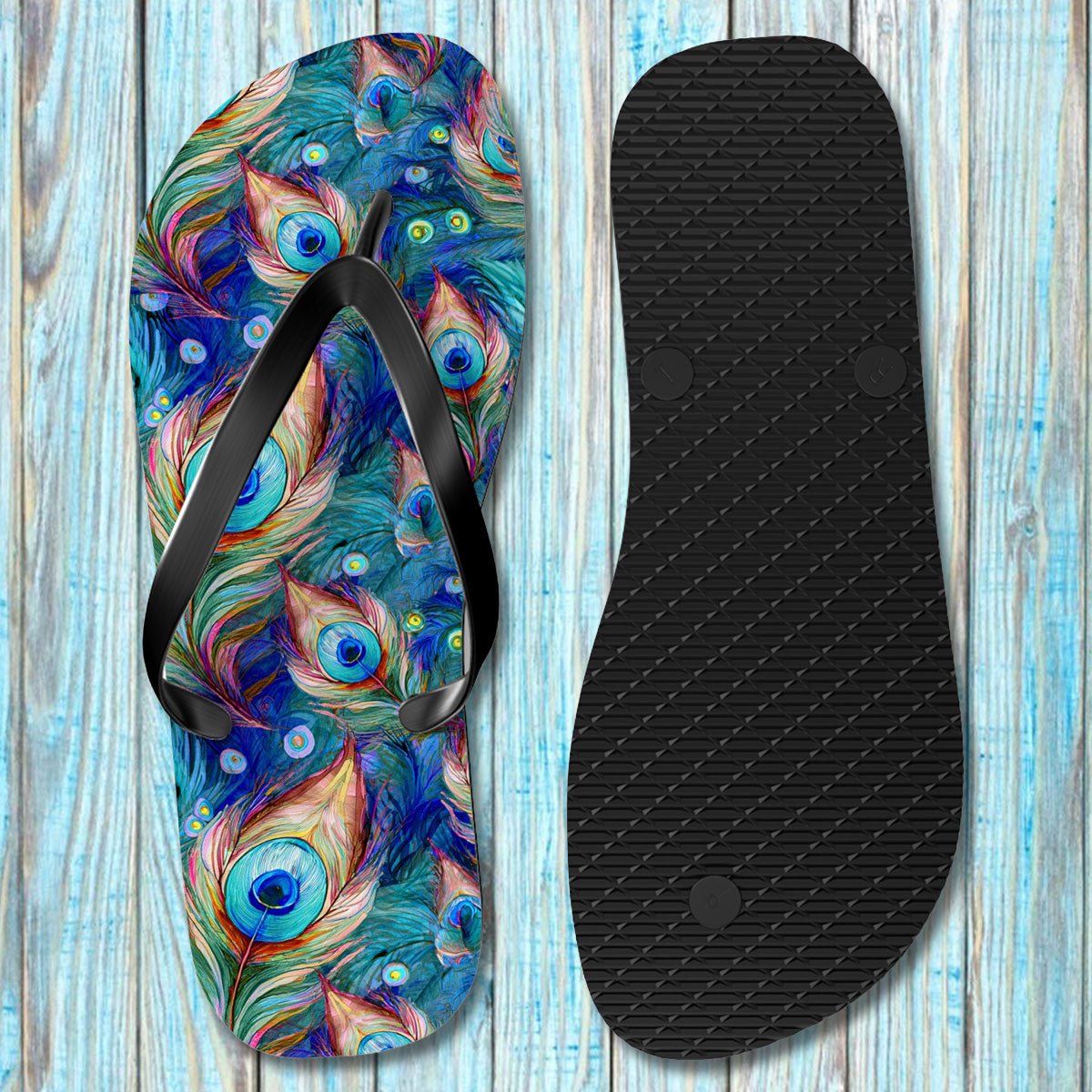 Flip-flop with peacock feather design on a wooden surface