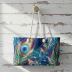 Colorful peacock feather patterned bag hanging on a wooden wall.