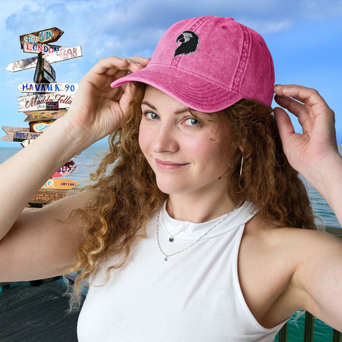 Woman wearing a pink Parrot Head Hat with a scenic background