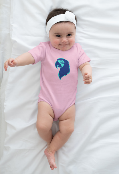 Baby wearing a pink onesie with a blue design on a white blanket