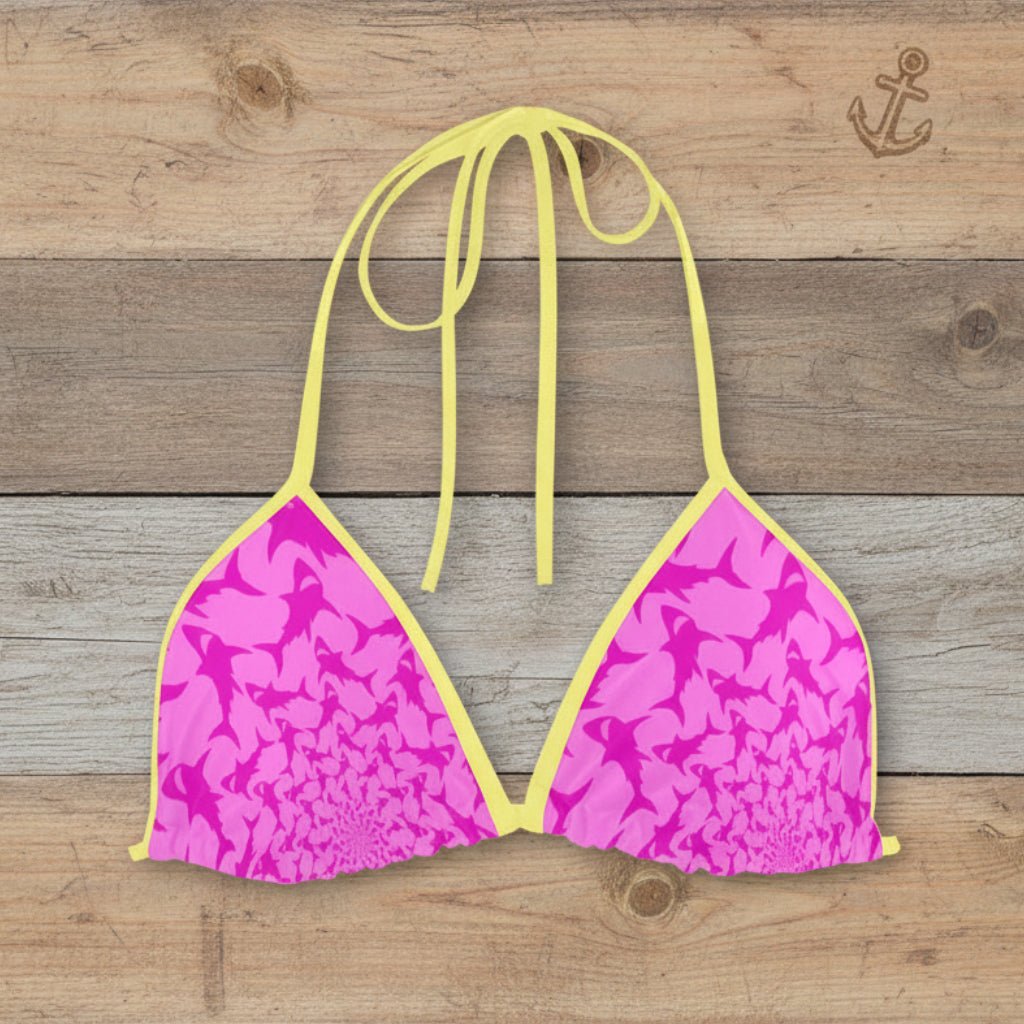 Hot Pink bikini top with yellow straps on a rustic wood background