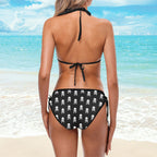 Lady wearing a Pirate Skull Pattern String Bikini lookin out over the ocean.