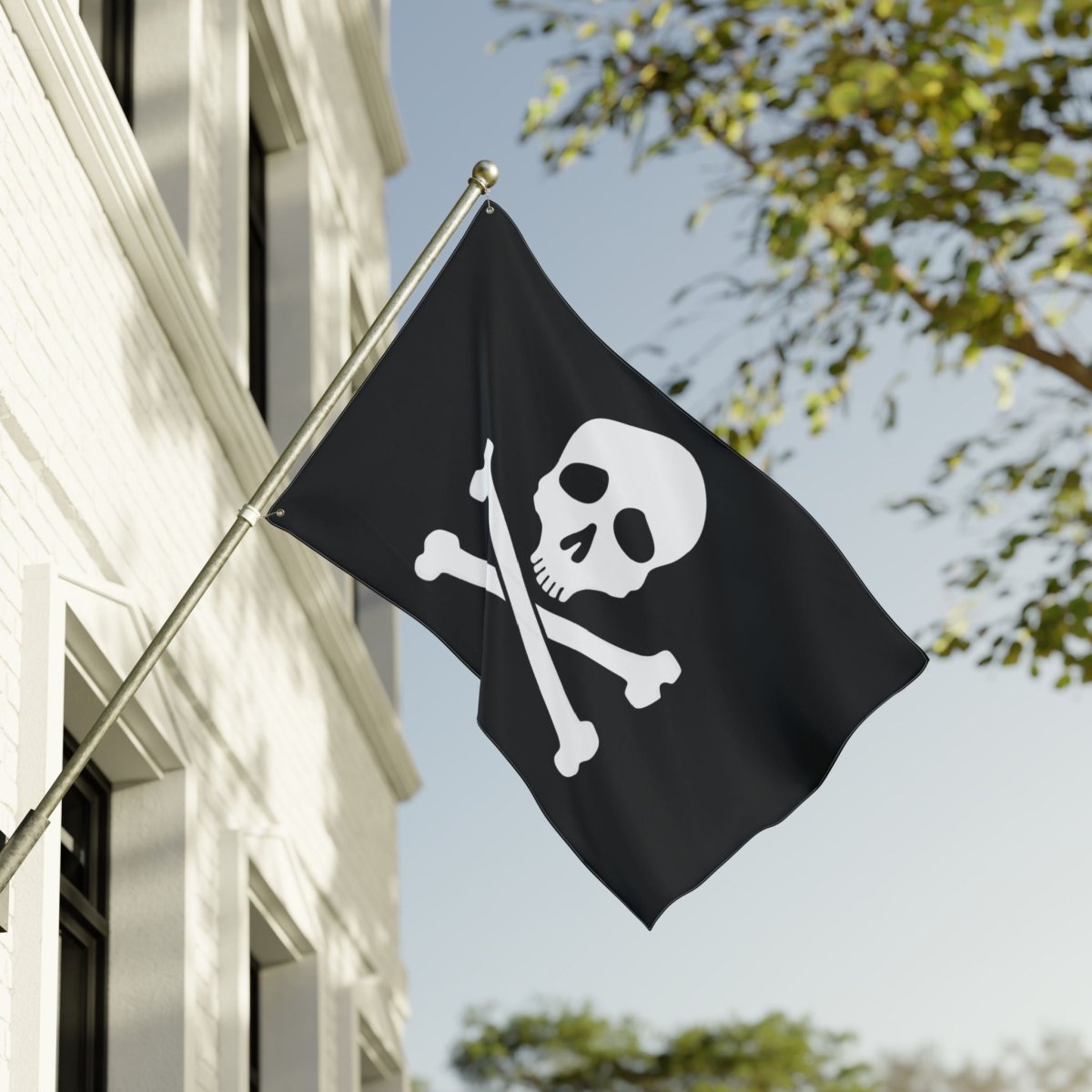 Black flag with a skull and crossbones design on a building exterior.