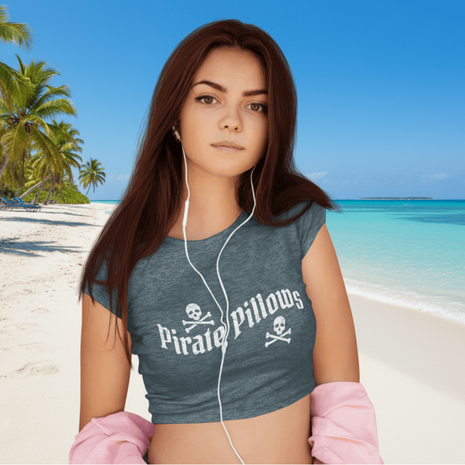 Woman wearing a gray t-shirt with 'Pirate Pillows' logo, listening to music with earphones.