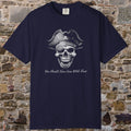 A navy blue short-sleeve t-shirt with a pirate skull graphic and the text 'You Should Have Gone With Treat' printed on the front, displayed against a rustic stone wall background.