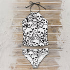 Skull and crossbones patterned bikini set on a wooden surface