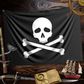 A 2 sided Jolly Roger Flag over Dark Wood and surrounded by pirate icons like a spyglass a ship's log and a sword