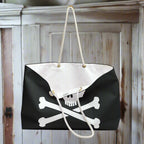 Jolly roger tote bag hanging from a hook in the captain's quarters of a pirate ship