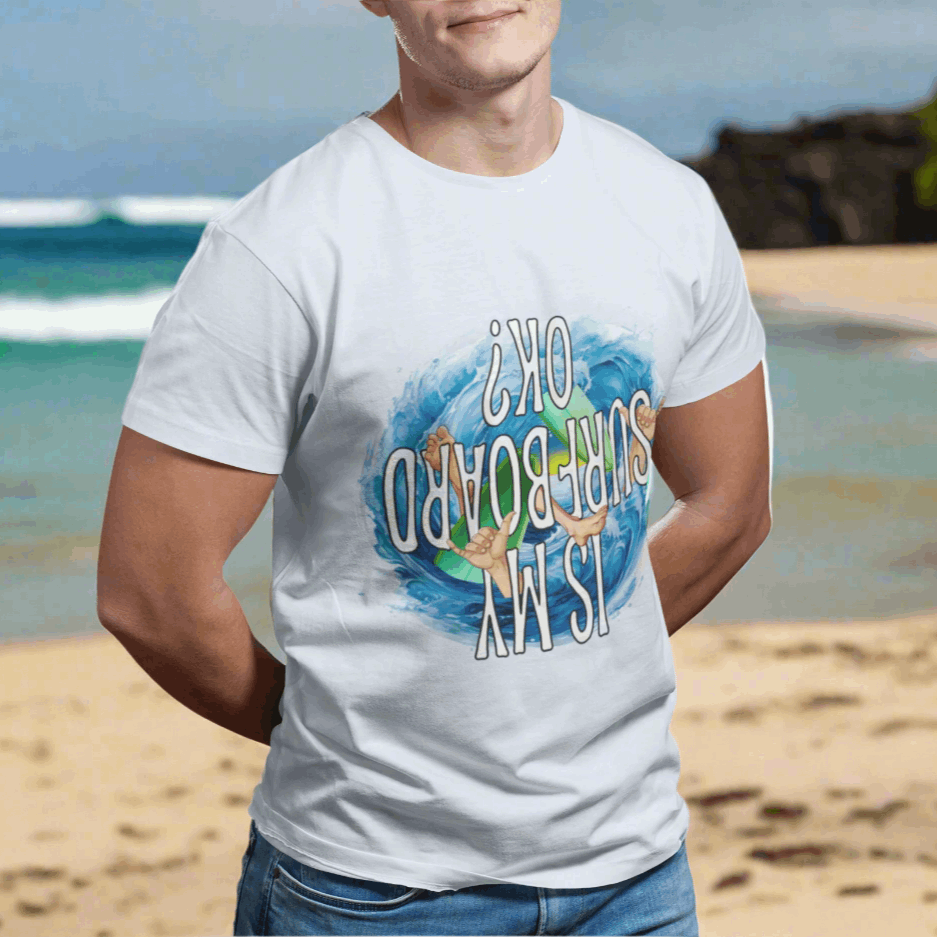 Surfer standing on the beach in Hawaii sporting a funny surf tee.