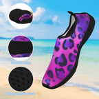 A single slip-on water shoe with a purple and pink leopard print upper and black sole, shown over a beach background with three circular inset detail callouts and text describing flexibility, breathable lining, and water-permeable outsole.