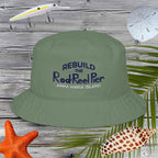Green bucket hat with text on a wooden background with fishing-related items.