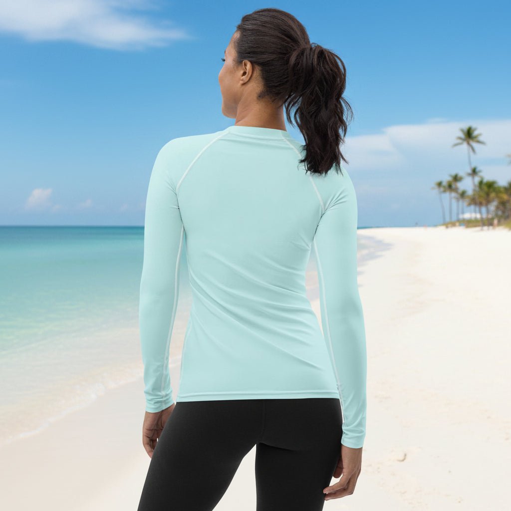 woman wearing a light blue long-sleeve sun shirt on Fort myers Beach